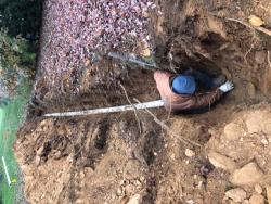 man doing outdoor repair on water lines